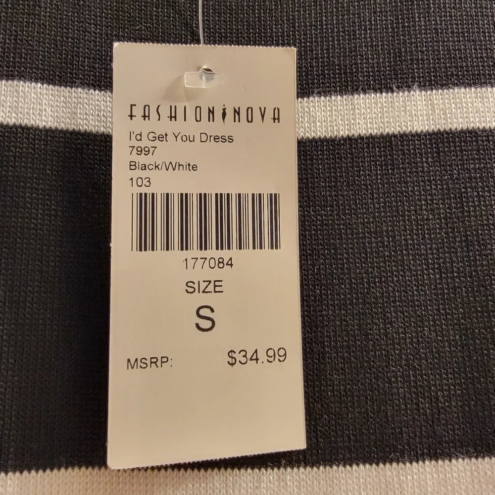 Never been worn black and white dress with side slit, in excellent condition. - Picture 4 of 5